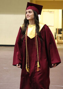 Graduate wearing cap and gown